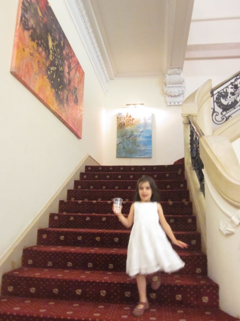Zoe feels like a princess on the Consulate stairs